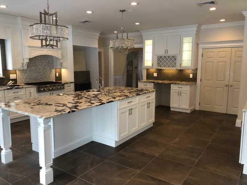 Two islands and a built-in coffee station in the finished kitchen